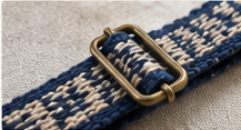 A narrow inkle-woven band fitted as a strap